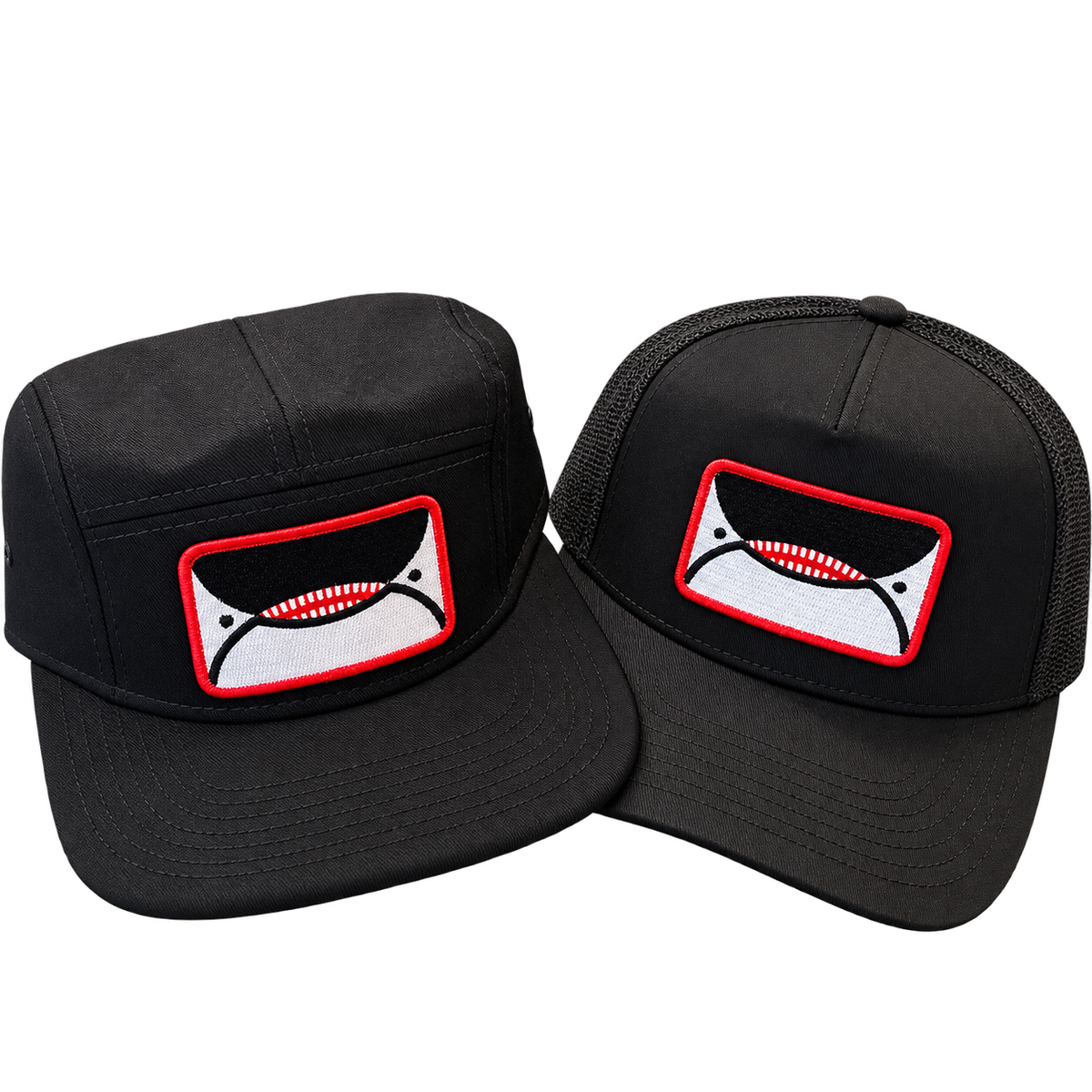 Black orca patch hats: five-panel camper and mesh-back trucker at Salty at Heart, Friday Harbor